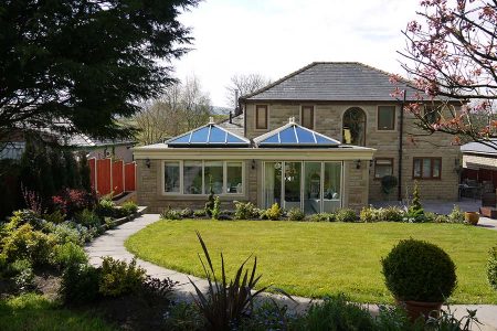 Cream orangery built using a brick structure and upvc lantern style roof